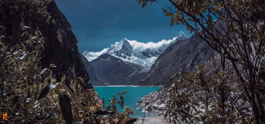 Ancash: Trekking to Paron Lagoon with Entrance | Full day| - The Cordillera Blanca peaks around the water