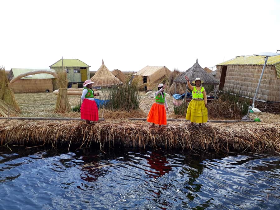 From Puno: full day tour to Uros and Taquile with Lunch - Starting in central Puno and reaching the port