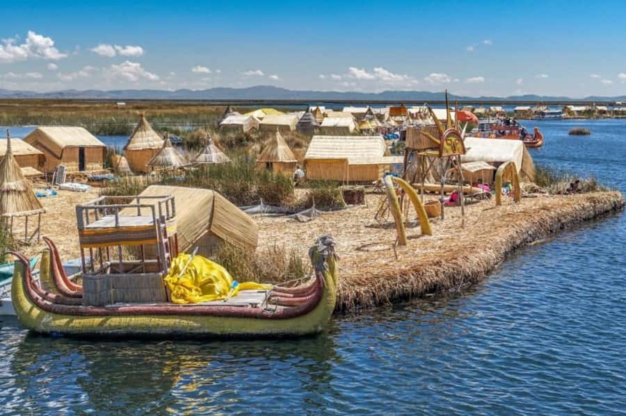 From Puno: Uros and Taquile Islands Full-Day Tour - Starting in Puno and reaching the dock