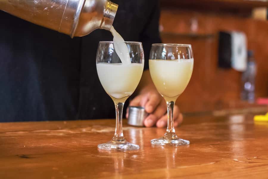 Lima: Lights, Pisco, and Fun Night Tour and Pisco Tasting - Walking through Plaza San Martín and Plaza Mayor