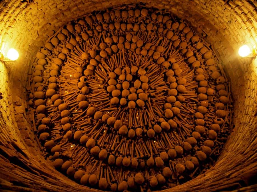 Lima: Water Magic Circuit, Downtown and Catacombs Night Tour - Walking through Lima’s Main Square after dark